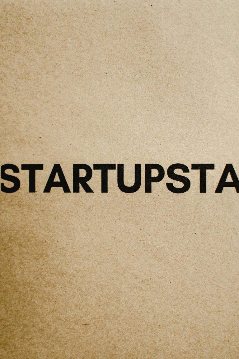 Minimalist close-up of the word 'startup' printed on brown paper, ideal for business themes.